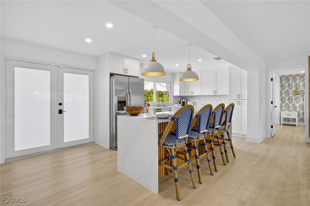 1377 Sand Castle Road Sanibel, FL 33957 - Photo 10 of 49 a view of a kitchen and dining room