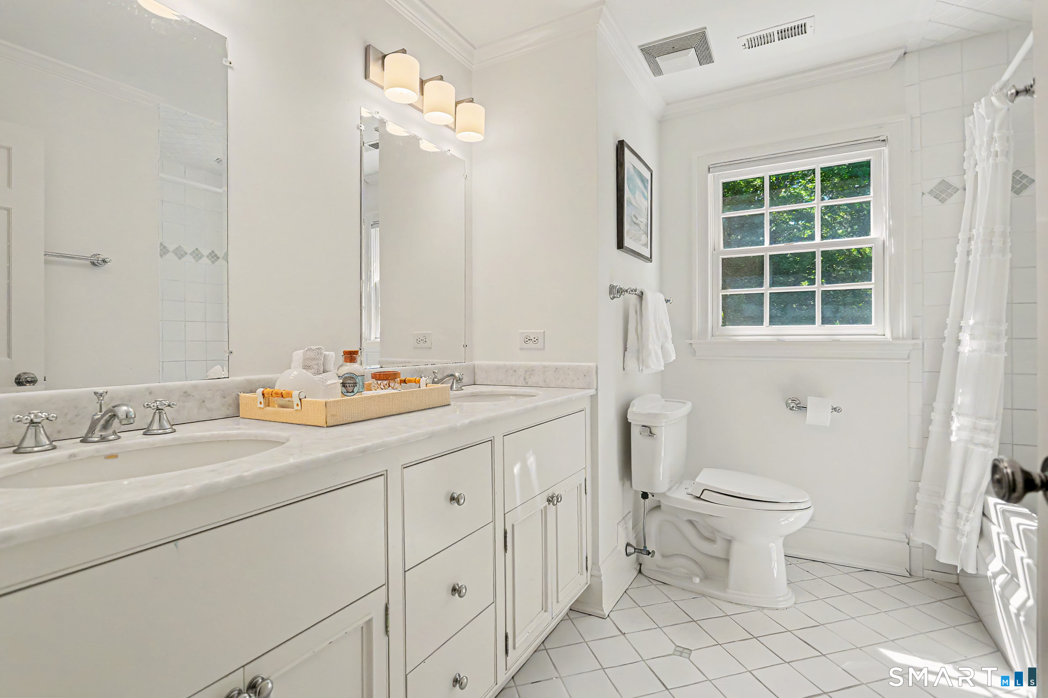 6 Adams Way Weston, CT 06883 - Photo 27 of 40 The upstairs hall bathroom has a shower w/jetted tub and vanity with dual sinks. (Not pictured are the adjacent laundry and walk-in linen closet next to this).