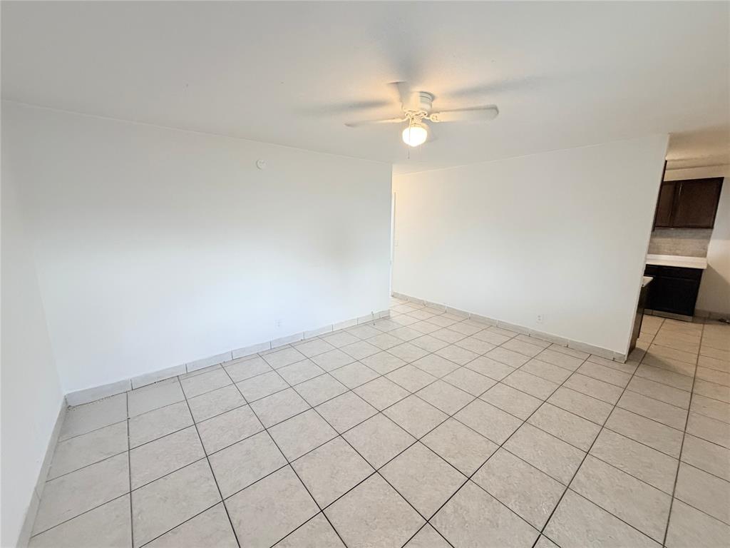1829 North A Street, Unit 13 Lake Worth Beach, FL 33460 - Photo 3 of 14 a view of an empty room and workspace