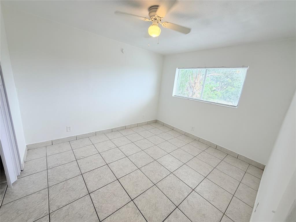 1829 North A Street, Unit 13 Lake Worth Beach, FL 33460 - Photo 8 of 14 an empty room with windows