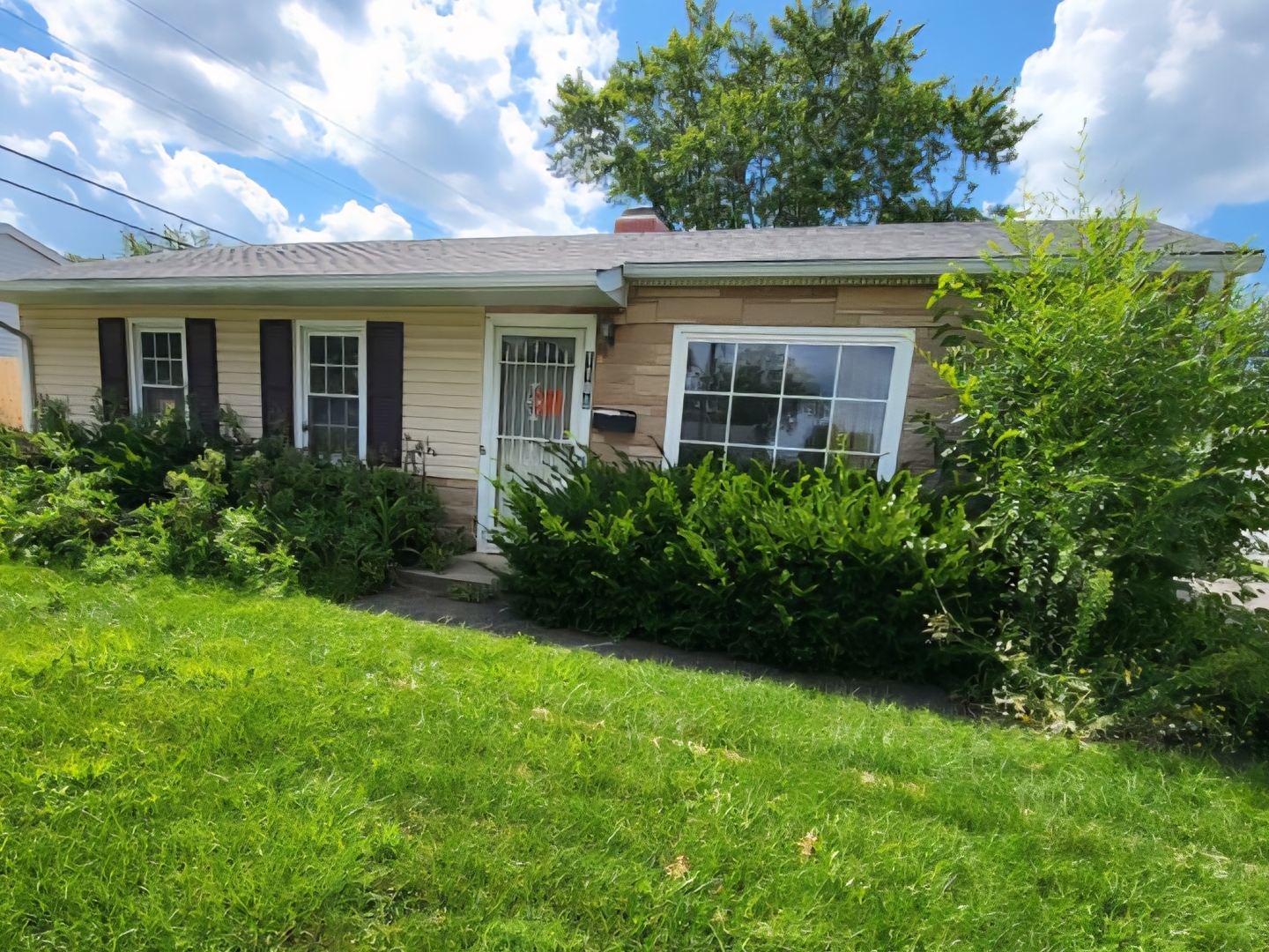 front view of a house with a yard