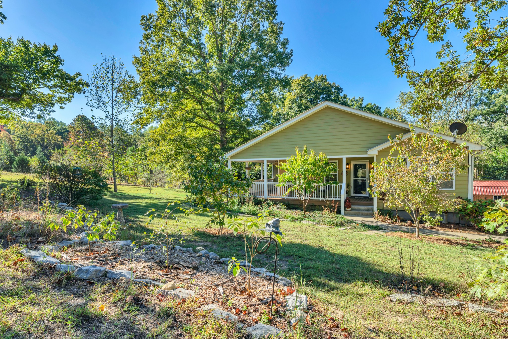 1475 Petty Road White Bluff, TN 37187 - Photo 54 of 55 a view of patio with a table and chairs under an umbrella