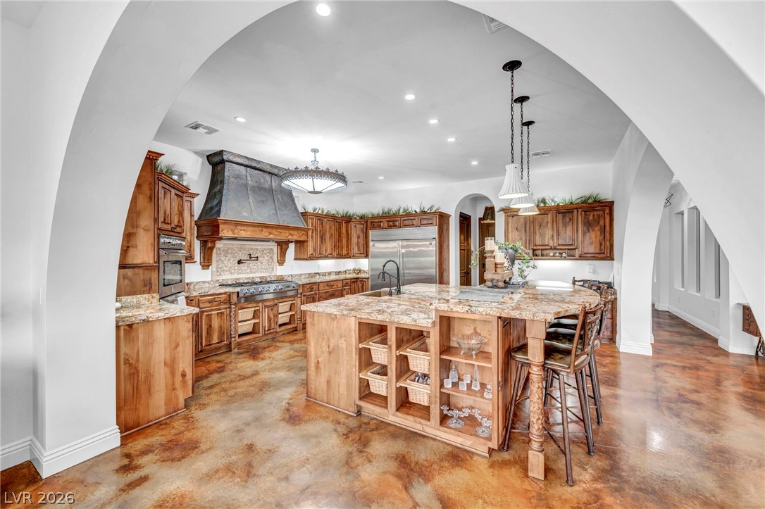 1158 Christian Road Henderson, NV 89002 - Photo 12 of 71 This spacious kitchen features custom cabinetry, stainless steel appliances, and a large central island.