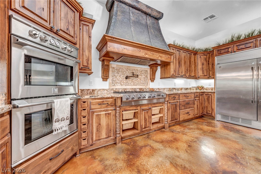 1158 Christian Road Henderson, NV 89002 - Photo 13 of 71 This spacious kitchen offers ample cabinet space and modern appliances for culinary pursuits.