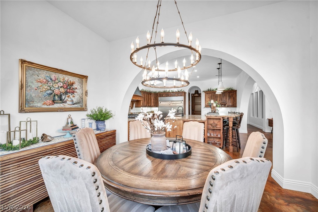 1158 Christian Road Henderson, NV 89002 - Photo 16 of 71 This spacious dining area seamlessly flows into a well-appointed kitchen, perfect for entertaining.