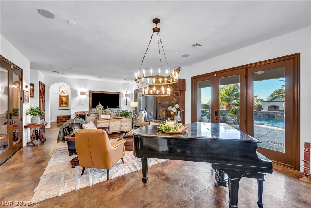1158 Christian Road Henderson, NV 89002 - Photo 71 of 71 This inviting living area boasts an open floorplan with a grand fireplace and direct access to the outdoors.