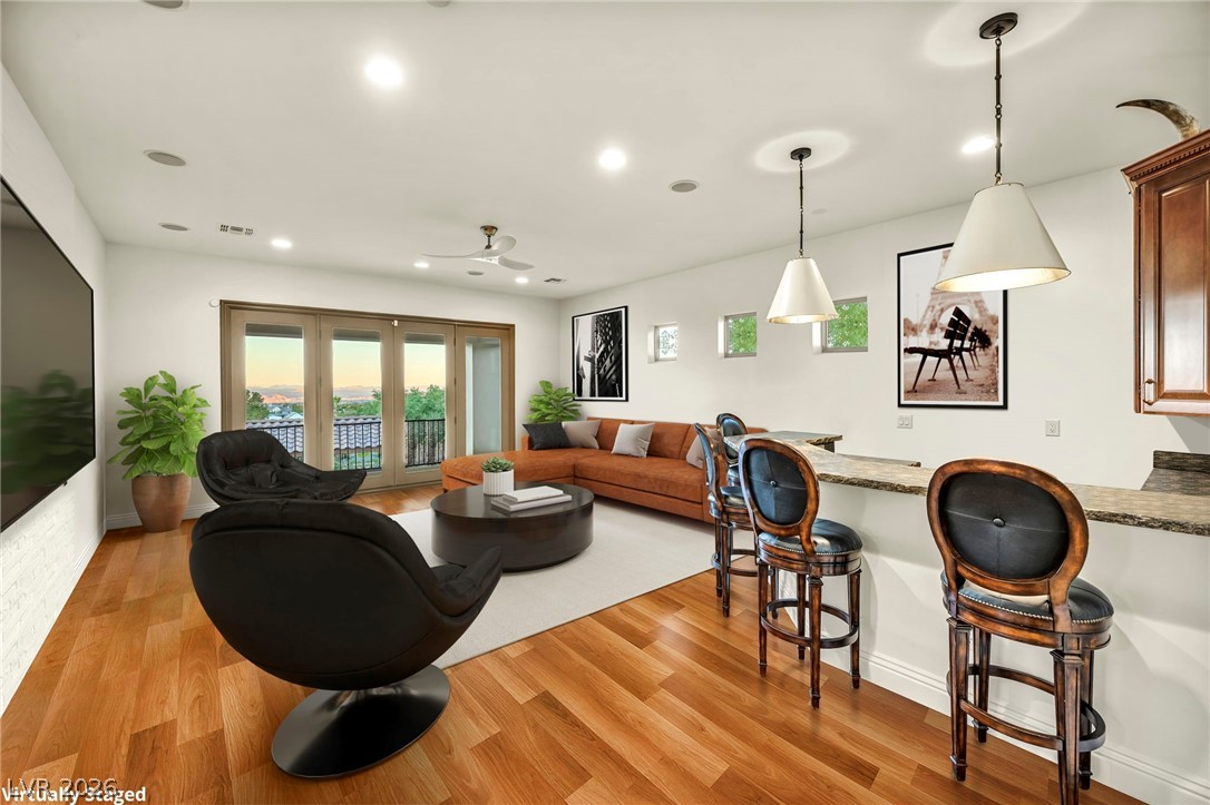 1158 Christian Road Henderson, NV 89002 - Photo 46 of 71 This inviting space features warm wood floors and ample natural light, perfect for everyday living.