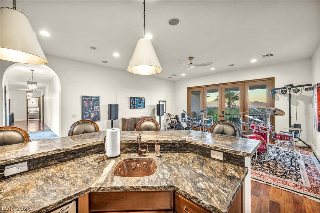 1158 Christian Road Henderson, NV 89002 - Photo 48 of 71 This versatile room features an impressive wet bar, perfect for entertaining.