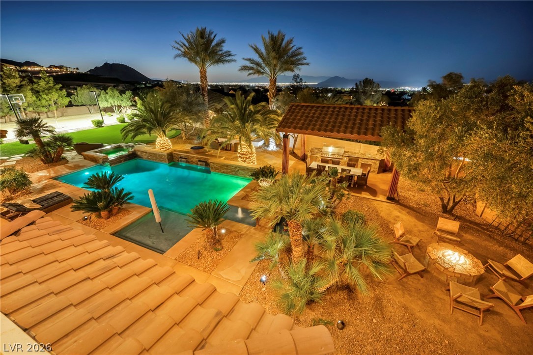 1158 Christian Road Henderson, NV 89002 - Photo 52 of 71 This outdoor oasis features a refreshing pool, a relaxing spa, and an inviting fire pit.