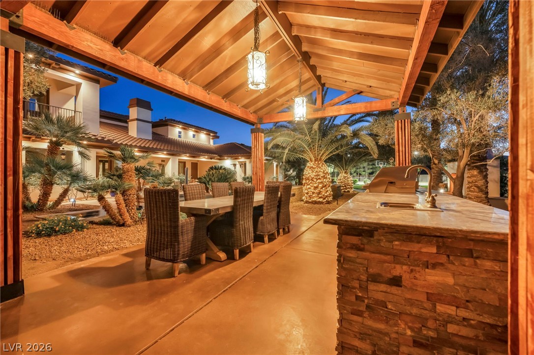 1158 Christian Road Henderson, NV 89002 - Photo 58 of 71 This private backyard oasis offers an outdoor kitchen for alfresco dining.