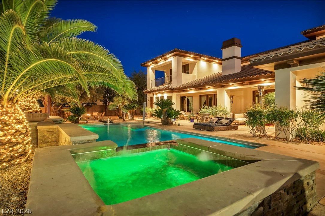 1158 Christian Road Henderson, NV 89002 - Photo 60 of 71 This magnificent residence features a sparkling pool and spa, perfect for evening relaxation.