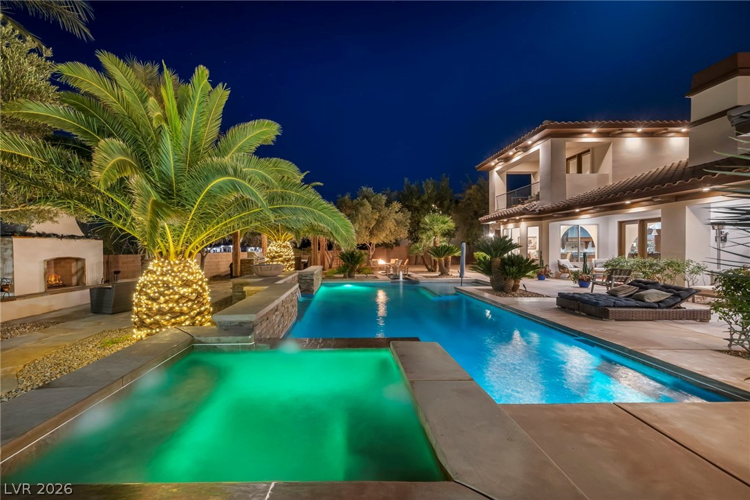1158 Christian Road Henderson, NV 89002 - Photo 61 of 71 This magnificent outdoor oasis features a refreshing pool, rejuvenating spa, and inviting outdoor fireplace.