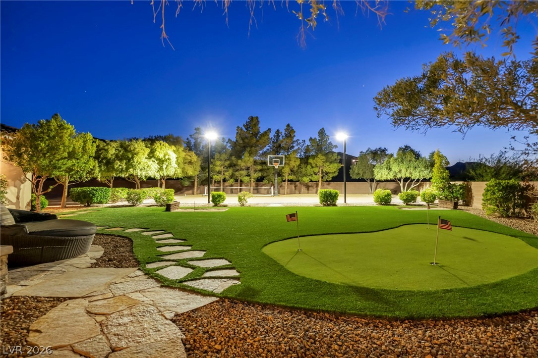 1158 Christian Road Henderson, NV 89002 - Photo 66 of 71 An inviting outdoor space featuring a private putting green and basketball court, perfect for recreation.