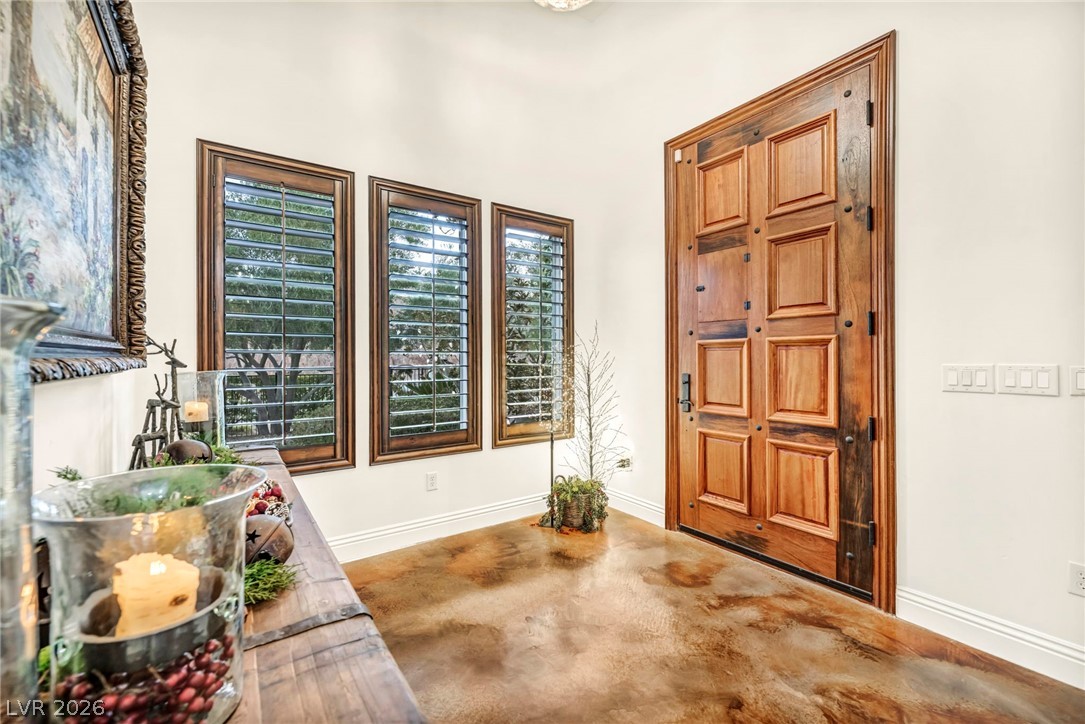 1158 Christian Road Henderson, NV 89002 - Photo 9 of 71 This entry features rich wood details and a warm, inviting floor.