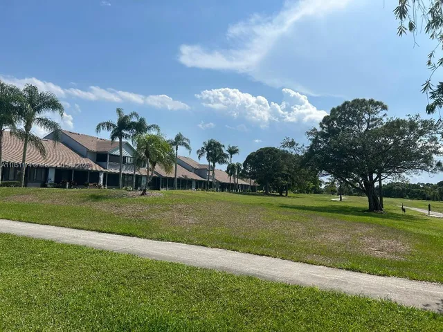 an aerial view of residential building and trees