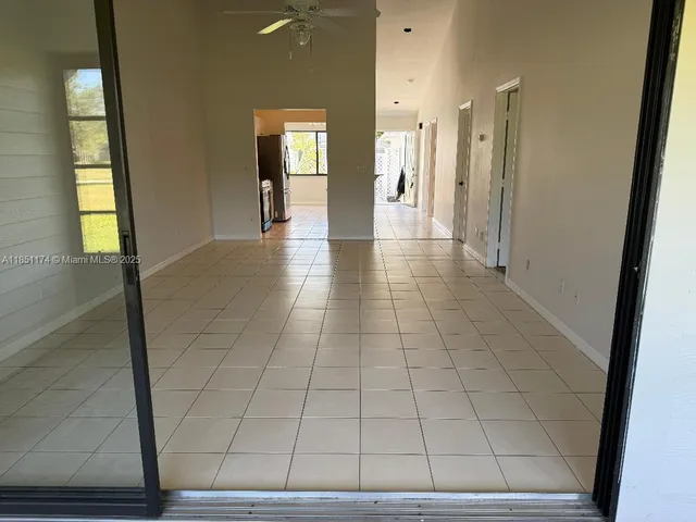 a view of hallway with windows