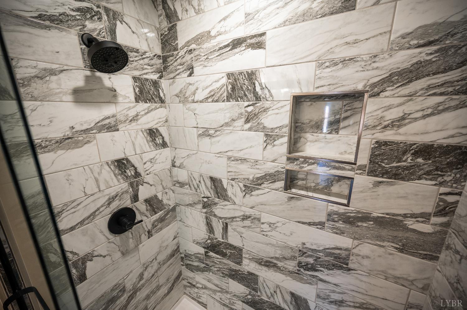 61 Luke Court Rustburg, VA 24588 - Photo 25 of 39 a bathroom with a sink toilet and shower