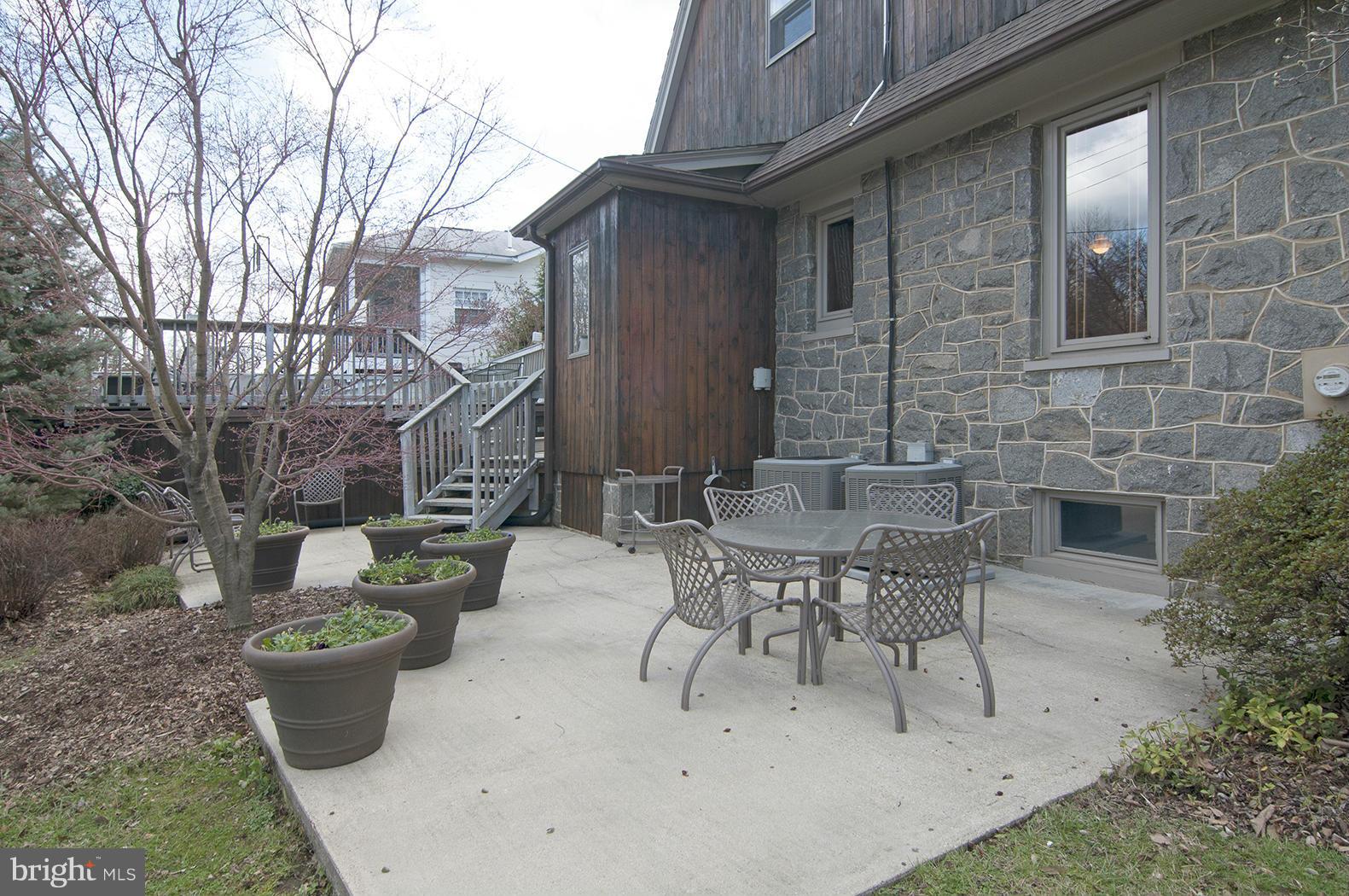 4000 Harrison Street Northwest Washington, DC 20015 - Photo 19 of 23 a view of a patio with table and chairs and potted plants