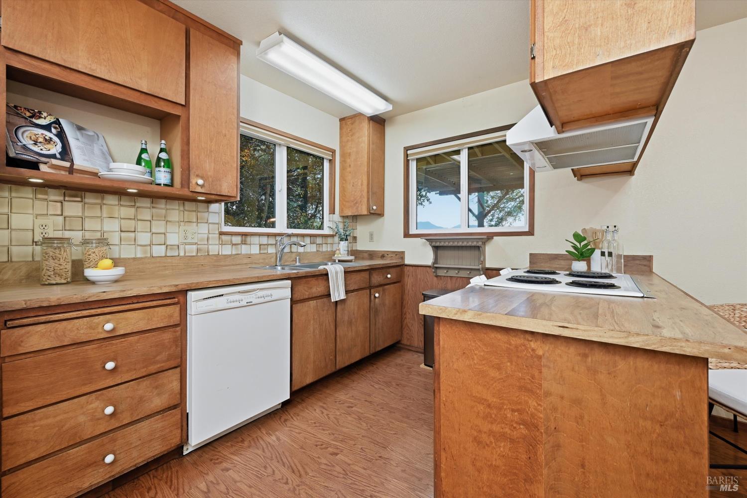 19897 Donkey Hill Road Hidden Valley Lake, CA 95467 - Photo 8 of 45 a kitchen with a sink stove and cabinets