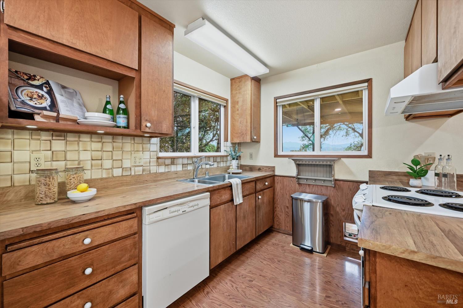 19897 Donkey Hill Road Hidden Valley Lake, CA 95467 - Photo 10 of 45 a kitchen with stainless steel appliances granite countertop a sink stove and cabinets