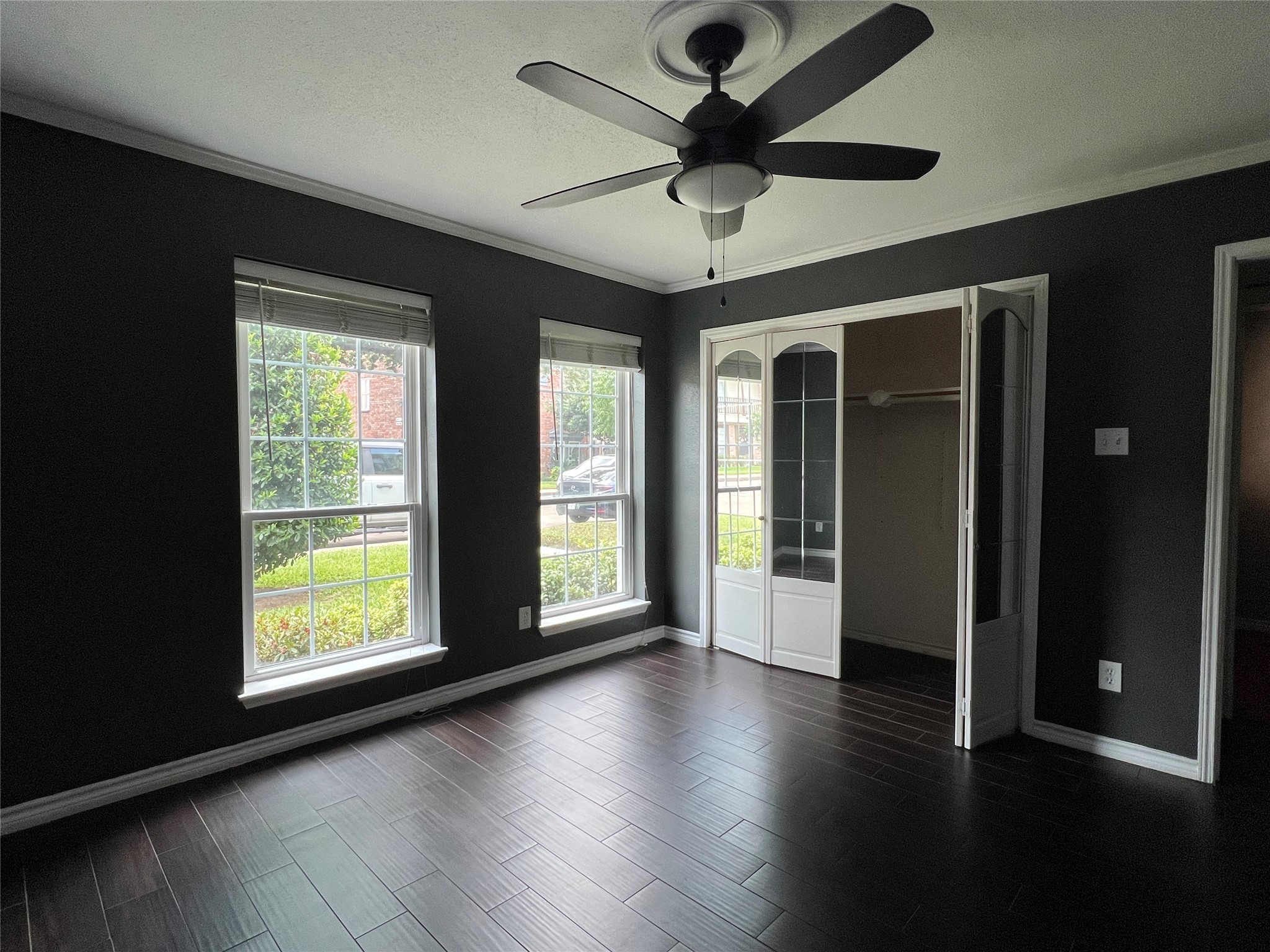 5801 Lumberdale Road, Unit 165 Houston, TX 77092 - Photo 20 of 32 a view of an empty room with wooden floor and a window