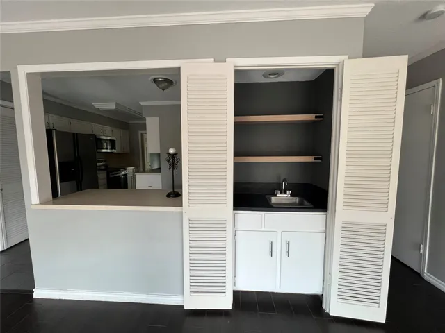 a view of cabinets and window