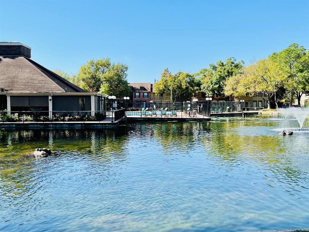 5801 Lumberdale Road, Unit 165 Houston, TX 77092 - Photo 3 of 32 a view of a lake with houses