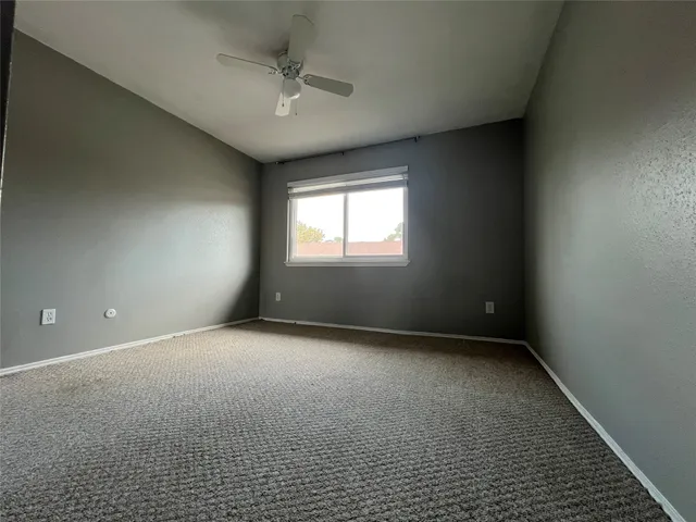 an empty room with a empty space and windows