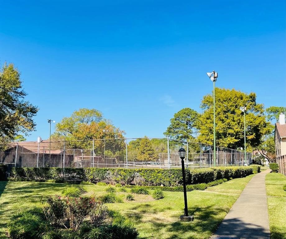 5801 Lumberdale Road, Unit 165 Houston, TX 77092 - Photo 10 of 32 a view of a street with houses