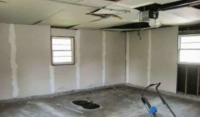 a view of a room with rack on the wall and a window