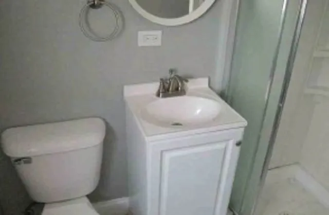 a bathroom with a toilet and a sink