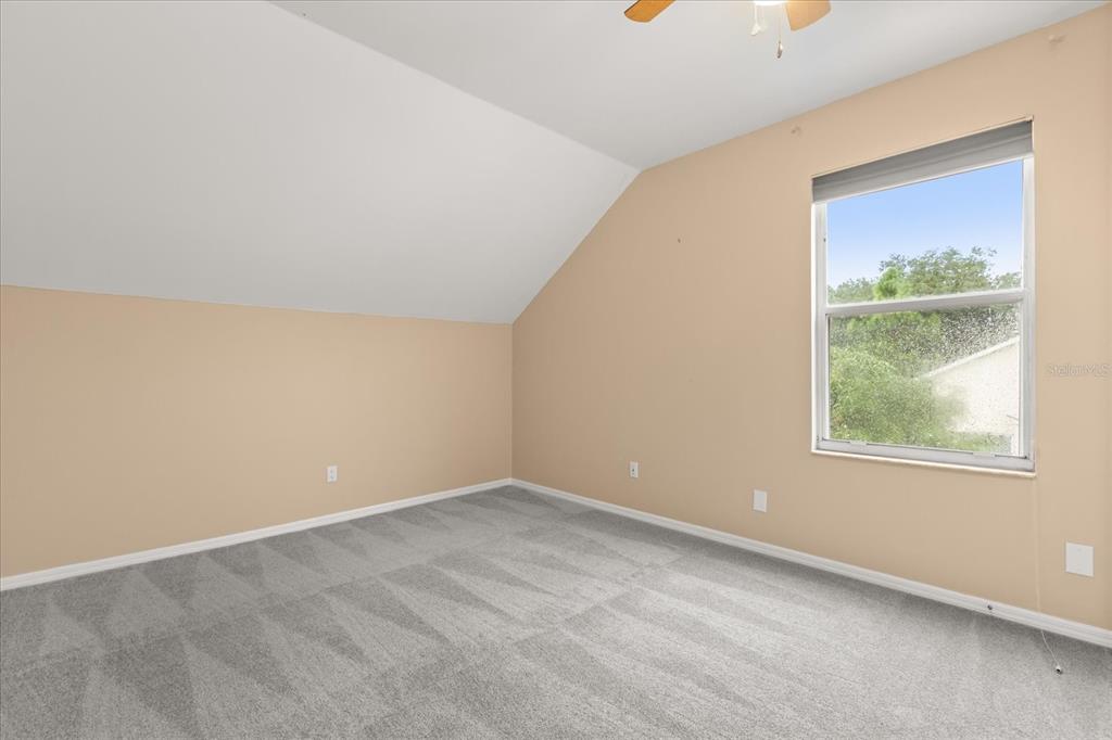 13607 Springtide Court Orlando, FL 32826 - Photo 12 of 32 an empty room with windows