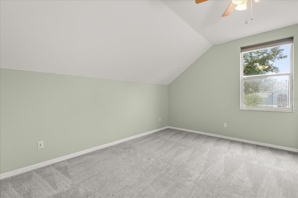 13607 Springtide Court Orlando, FL 32826 - Photo 15 of 32 an empty room with windows