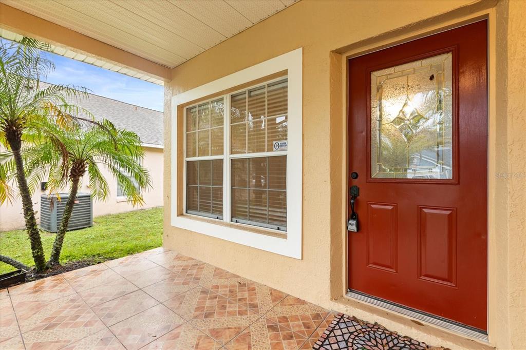 13607 Springtide Court Orlando, FL 32826 - Photo 2 of 32 a view of a door and a window