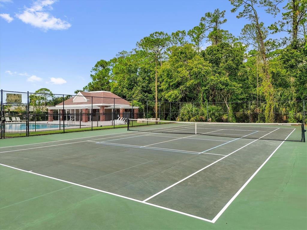 13607 Springtide Court Orlando, FL 32826 - Photo 28 of 32 a view of a tennis court