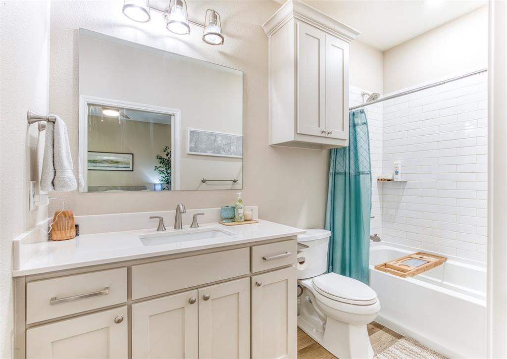 2121 Canyon Lake Road Wills Point, TX 75169 - Photo 26 of 40 a bathroom with a sink a toilet and shower