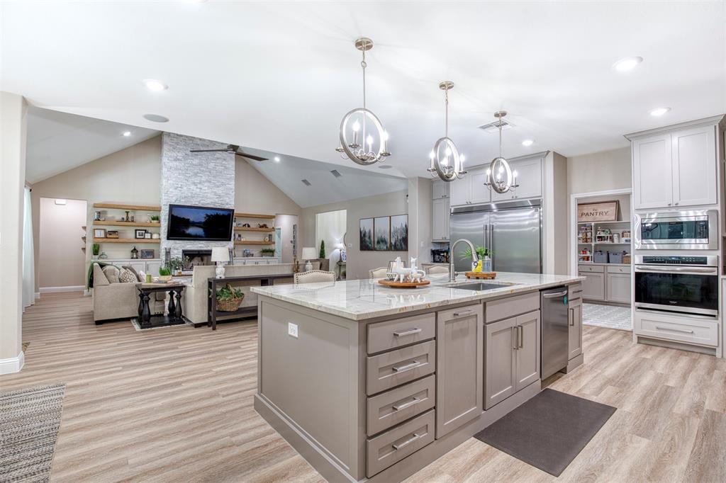 2121 Canyon Lake Road Wills Point, TX 75169 - Photo 3 of 40 a kitchen with stainless steel appliances granite countertop a stove and cabinets