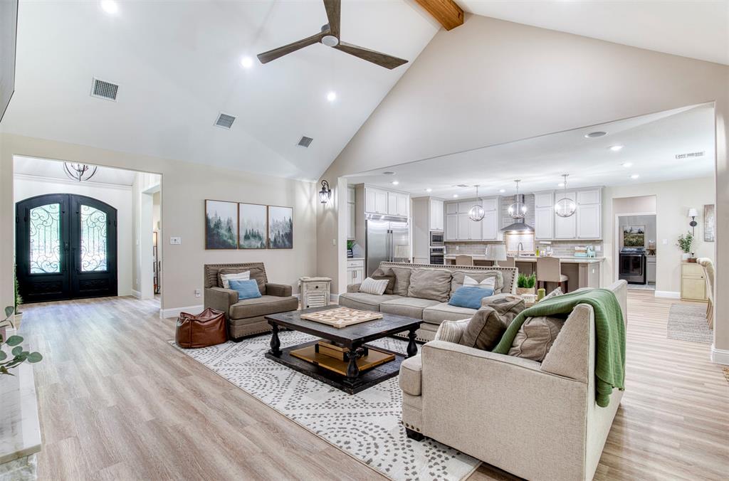 2121 Canyon Lake Road Wills Point, TX 75169 - Photo 8 of 40 a living room with furniture and a chandelier