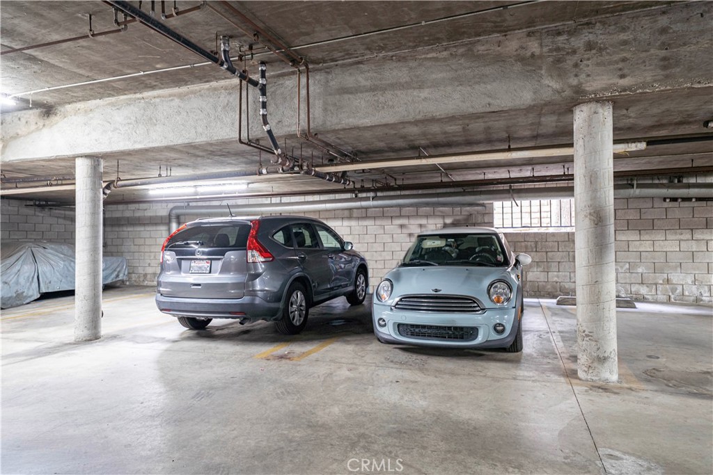14937 Sherman Way, Unit 7 Van Nuys, CA 91405 - Photo 35 of 37 a car parked in a garage