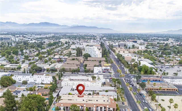 an aerial view of residential houses and city view