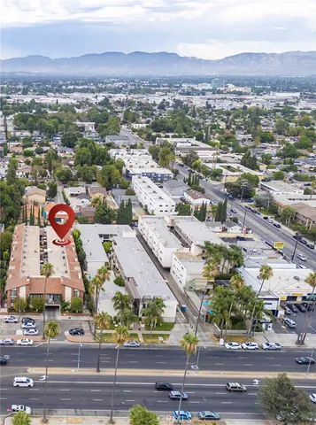 an aerial view of residential houses and outdoor space