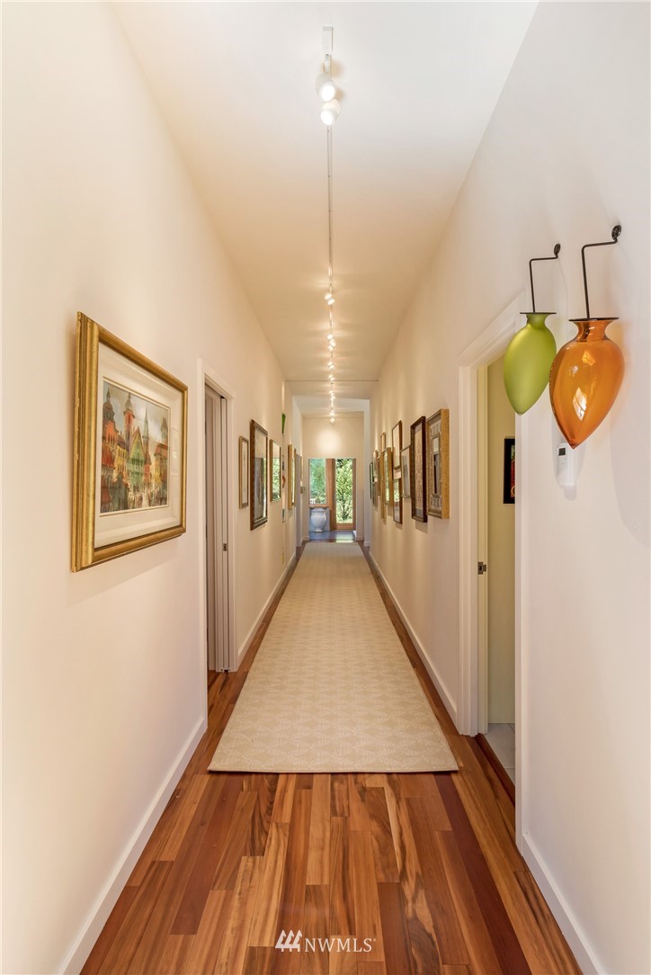 1224 Shark Reef Road Lopez Island, WA 98261 - Photo 12 of 34 a view of a hallway with wooden floor