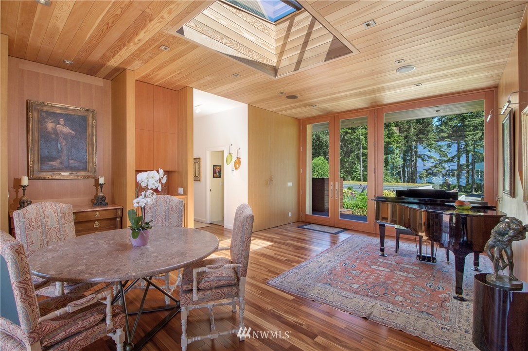 1224 Shark Reef Road Lopez Island, WA 98261 - Photo 16 of 34 a view of a dining room with furniture window and outside view