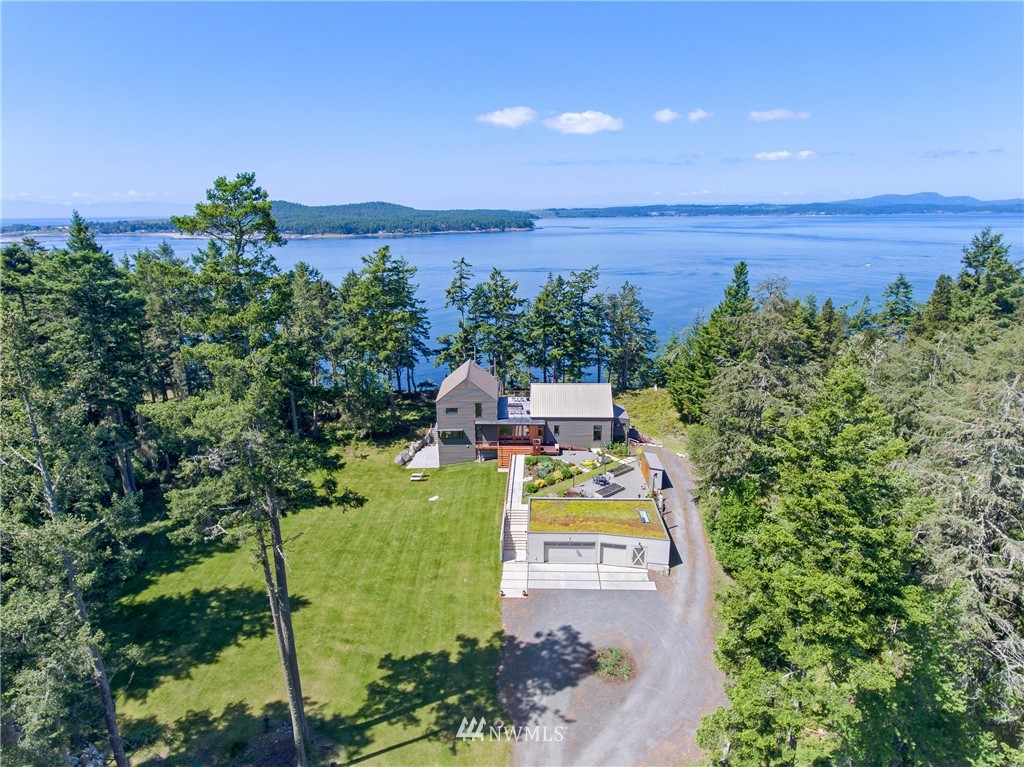 1224 Shark Reef Road Lopez Island, WA 98261 - Photo 17 of 34 an aerial view of a house with a garden and mountain view