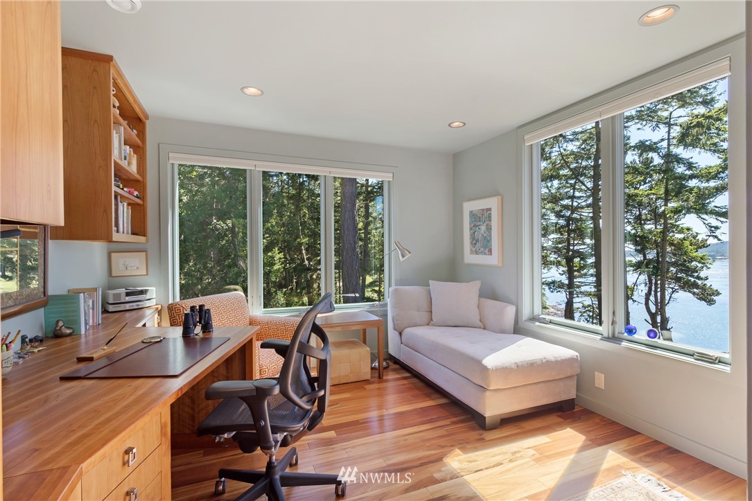 1224 Shark Reef Road Lopez Island, WA 98261 - Photo 3 of 34 a living room with furniture and large windows
