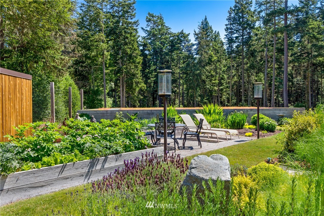 1224 Shark Reef Road Lopez Island, WA 98261 - Photo 30 of 34 a view of a garden with sitting area