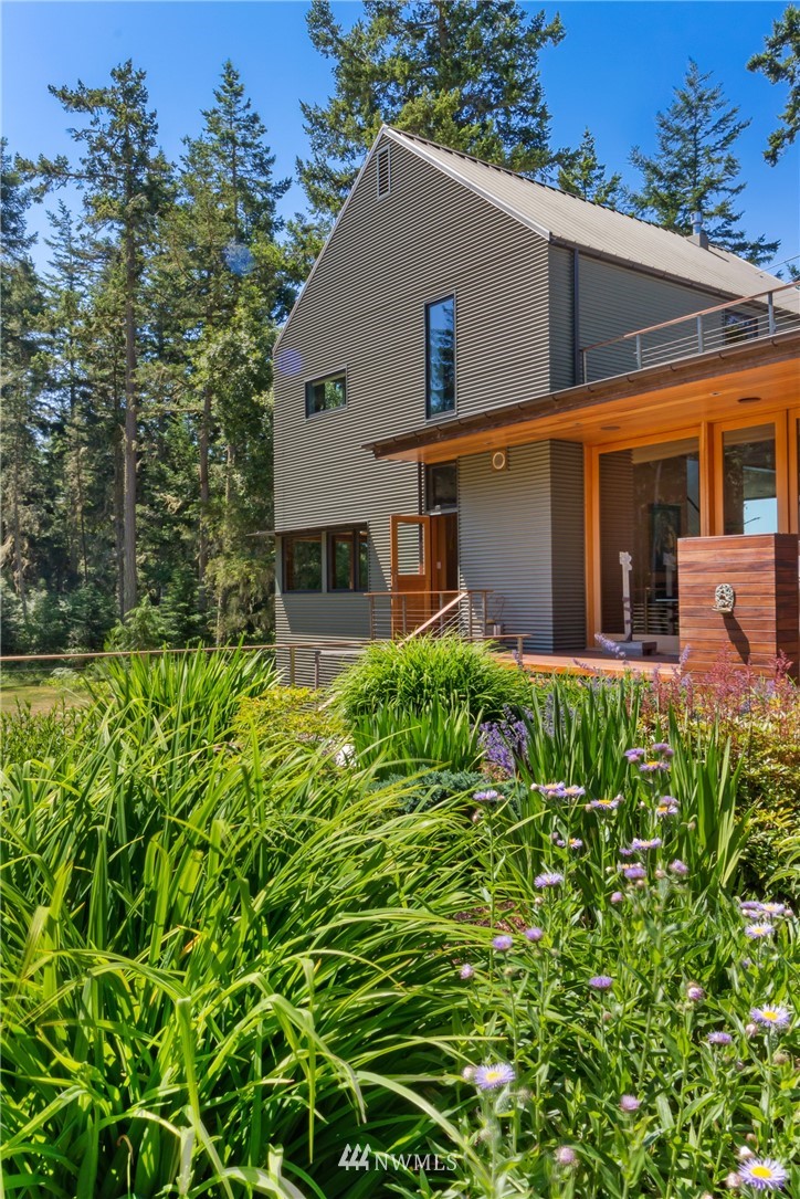 1224 Shark Reef Road Lopez Island, WA 98261 - Photo 33 of 34 a front view of a house with garden