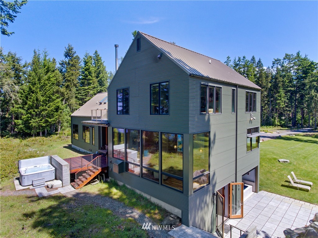 1224 Shark Reef Road Lopez Island, WA 98261 - Photo 8 of 34 front view of a house with a yard