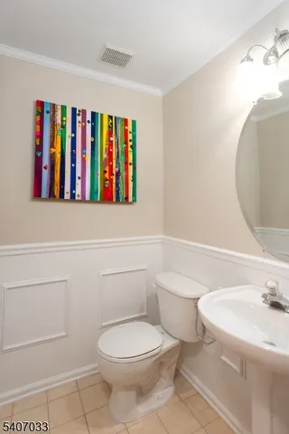 a bathroom with a toilet and a sink