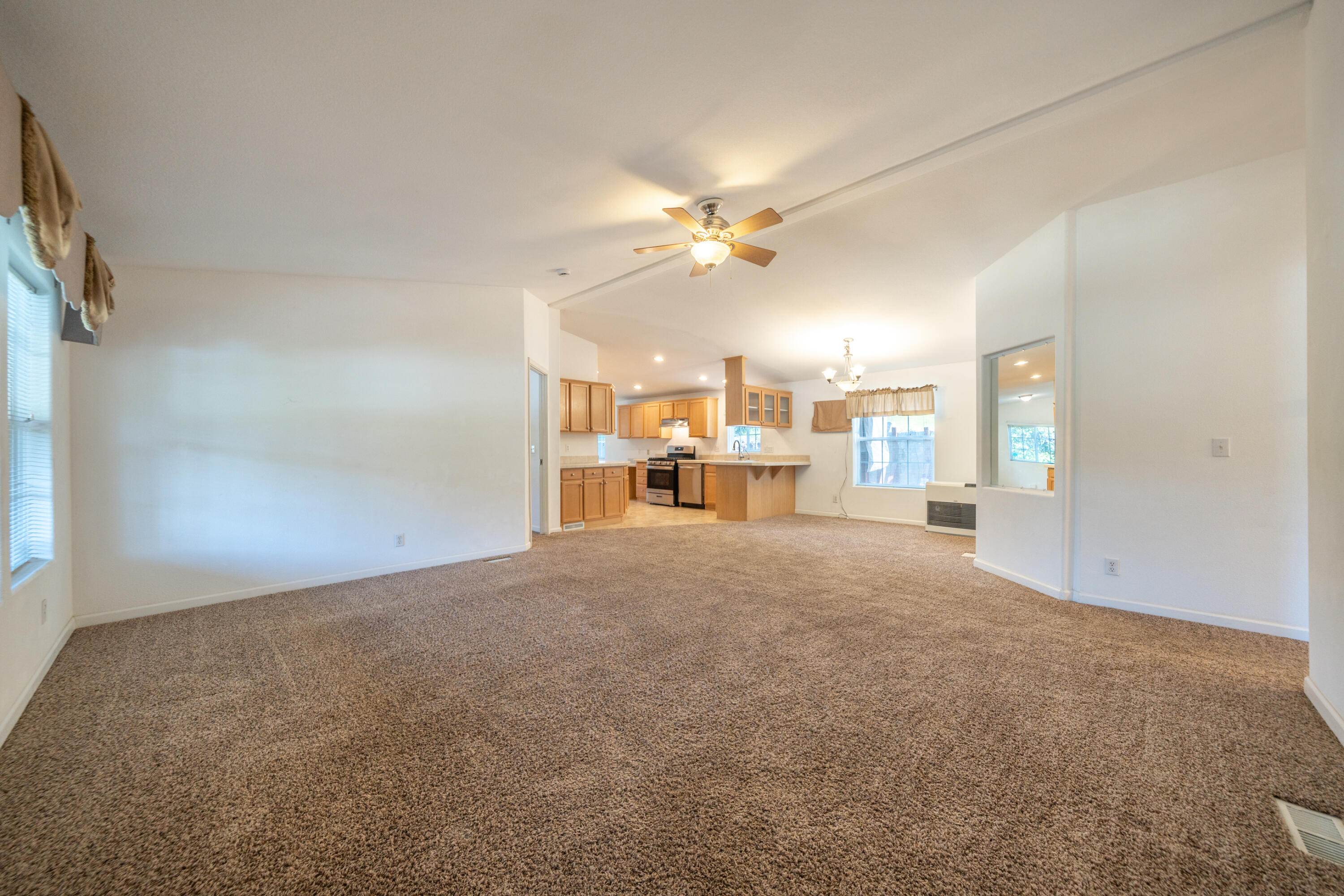 22151 Ravine Court Redding, CA 96003 - Photo 5 of 34 a view of a livingroom with a kitchen